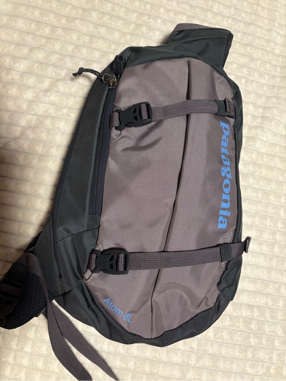 Patagonia Gray and Black Sling Pack with Blue Logo